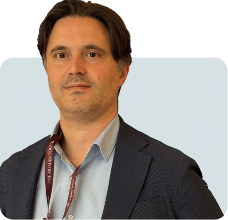 Έγχρωμο πορτρέτο του χειρουργού ουρολόγου με σακάκι και γαλάζιο πουκάμισο